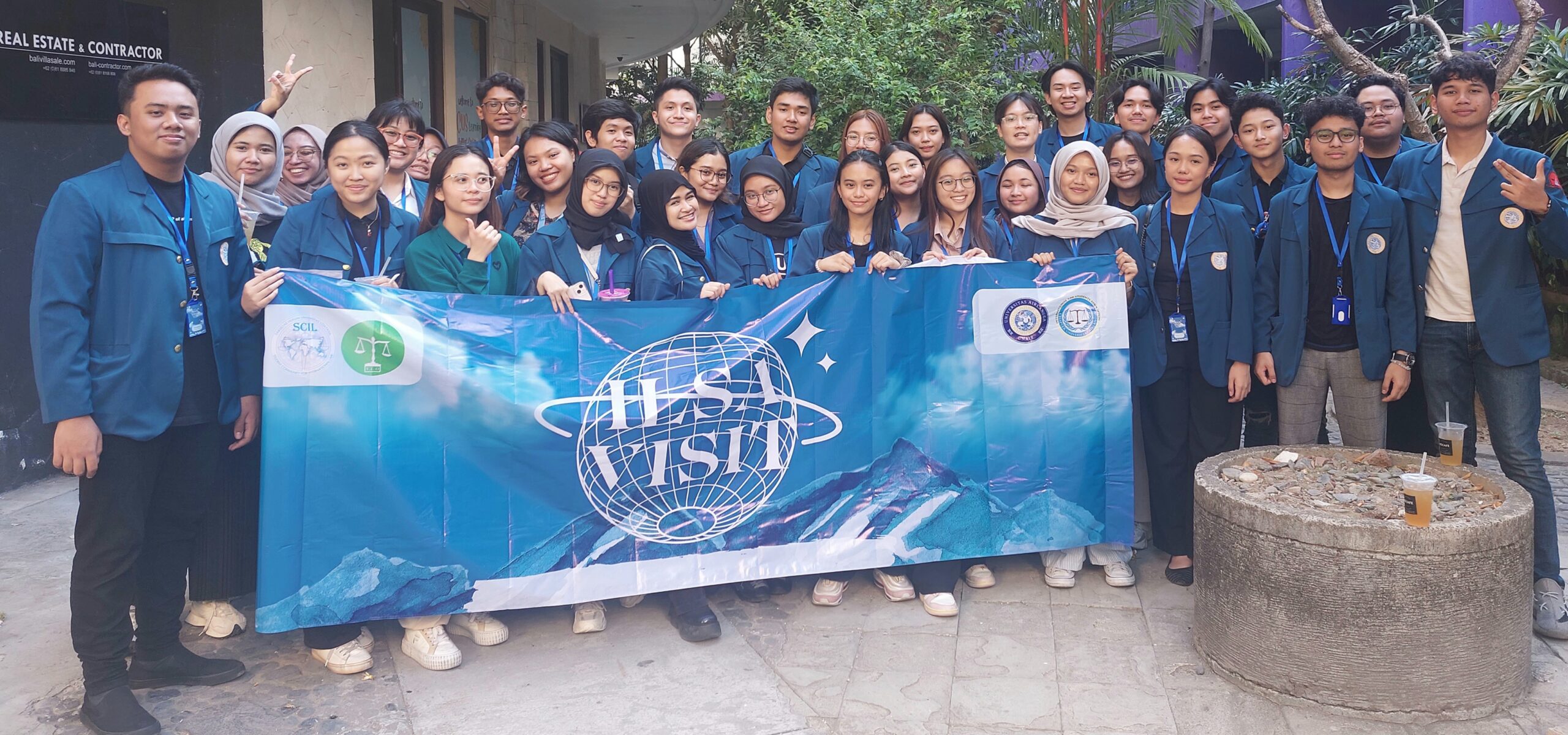 International Law Students Association posing with a sign.