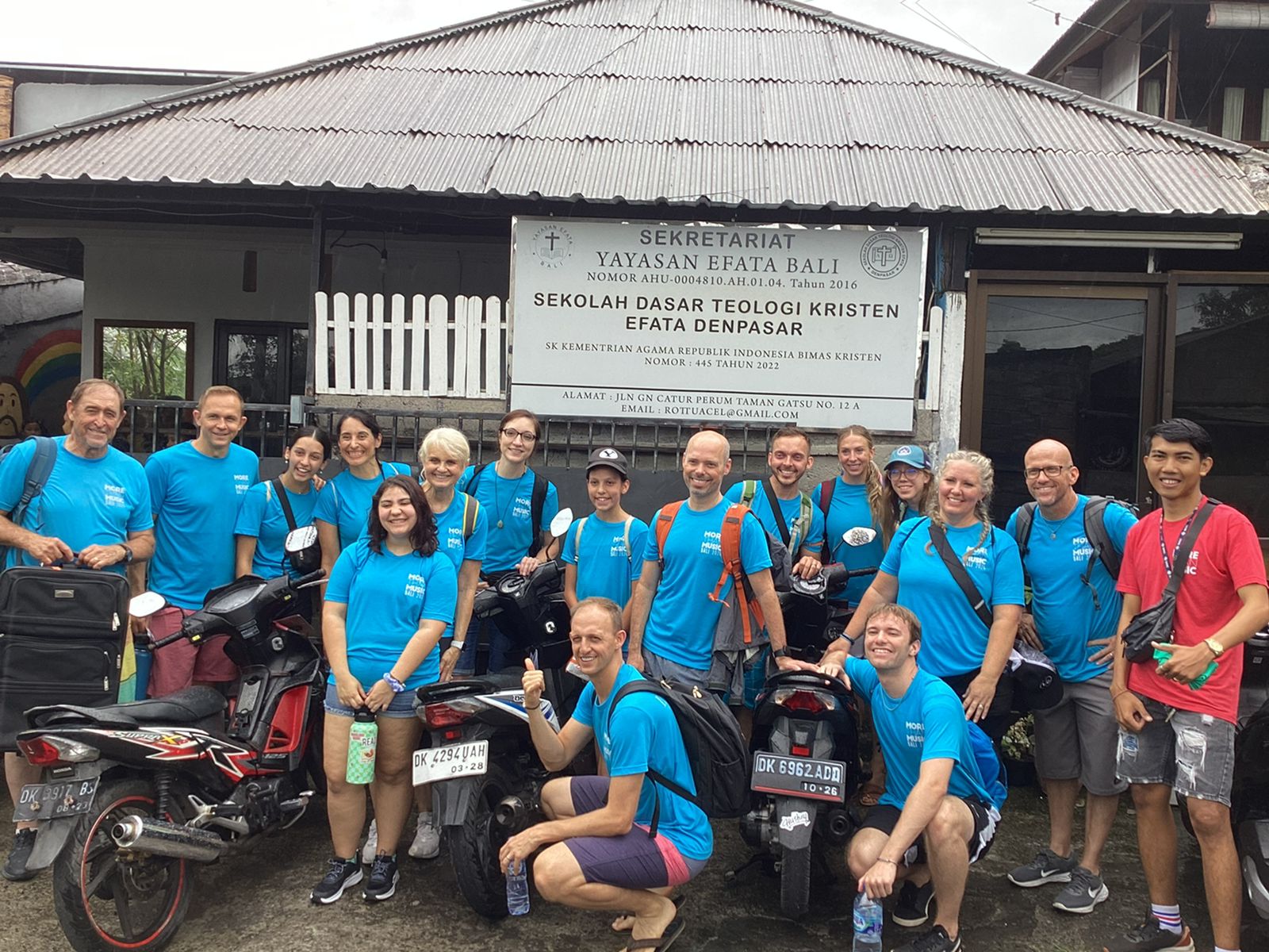 Volunteers pictured in front of EFATA.