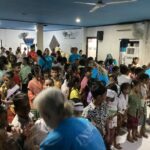 Volunteers saying hi to the children.