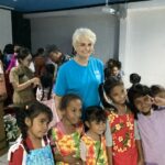 Group of 5 children and adult posing for a picture.