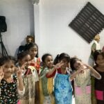 Local school children posing with peace signs.
