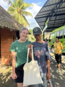Volunteer and child posing for a picture together