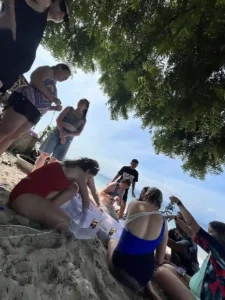 Volunteers siting by the beach.