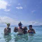 Volunteers posing with coral reef.