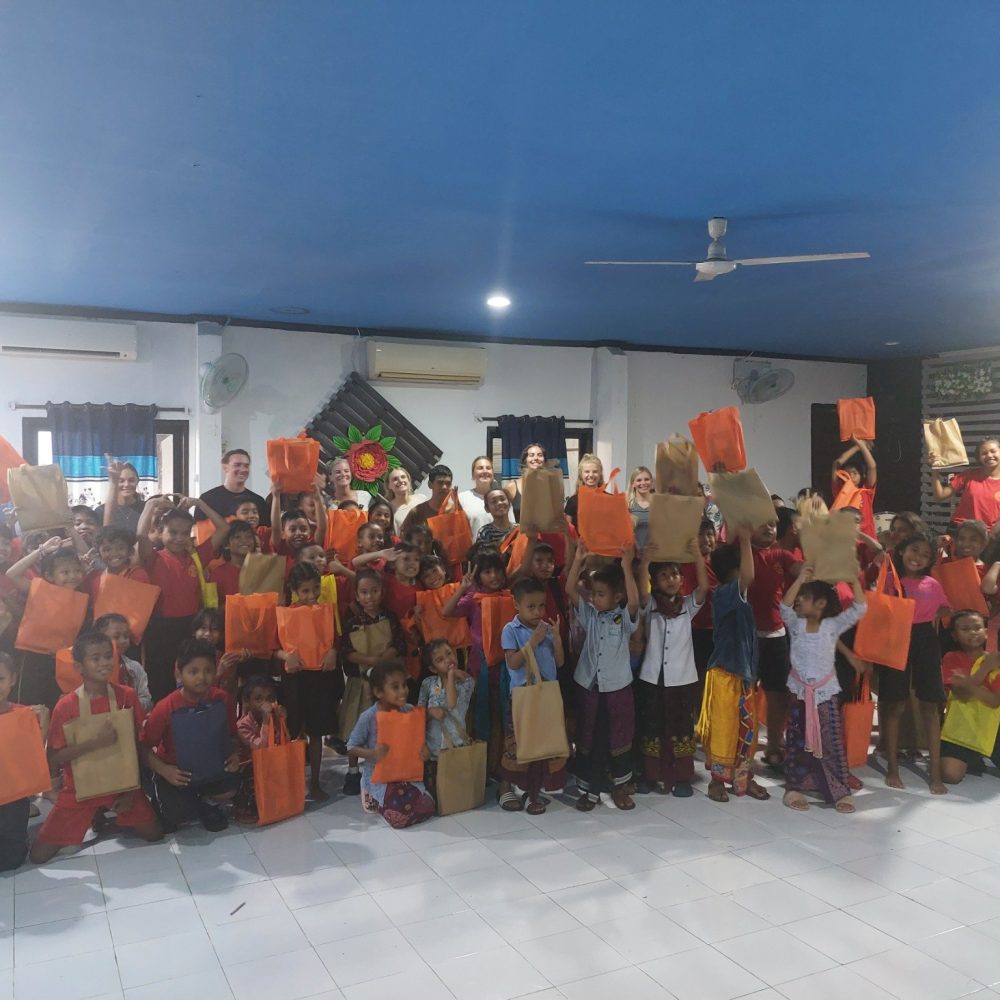Children holding up papers